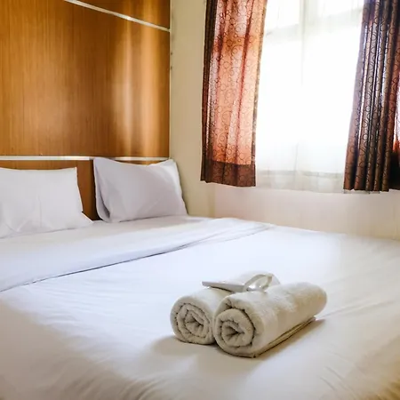 Homey 2Br At Suites @Metro Apartment By Travelio
